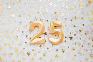 number 25 twenty five golden celebration birthday candle on festive background