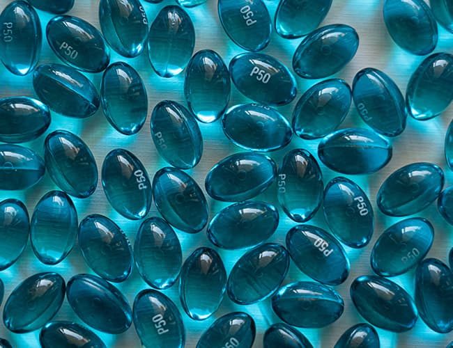 Blue pills iillustrates PlusChem's expertise in the Pharmaceutical industry